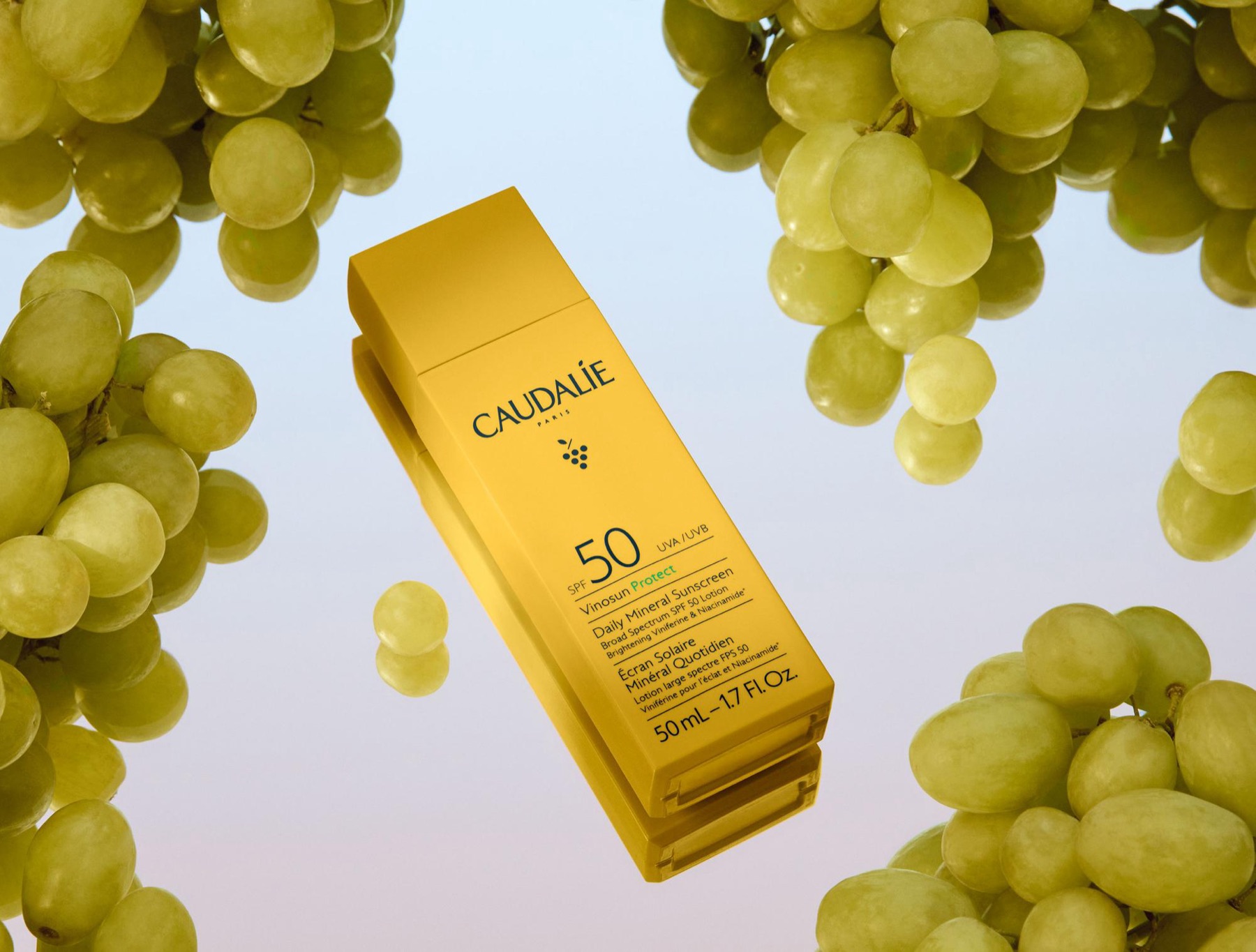 Caudalie skincare product photography surrounded by grapevines.
